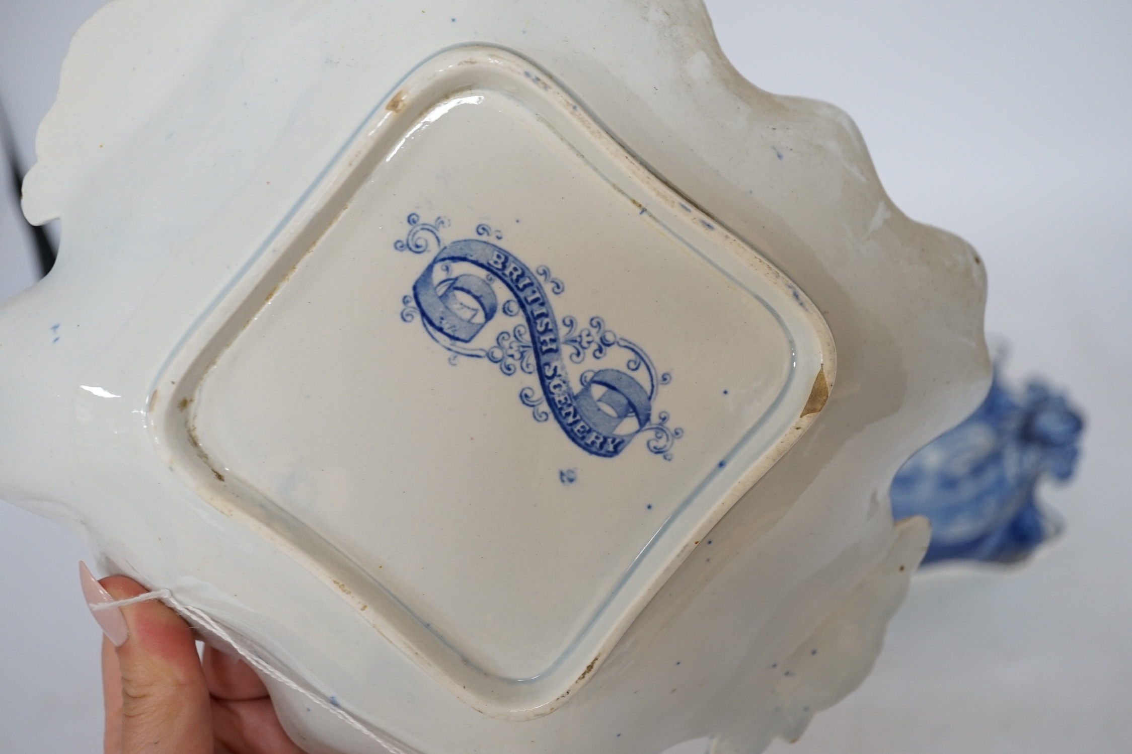 A pair of 19th century ‘British Scenery’, dessert dishes, with floral decorated handles, 24cm wide. Condition - good
